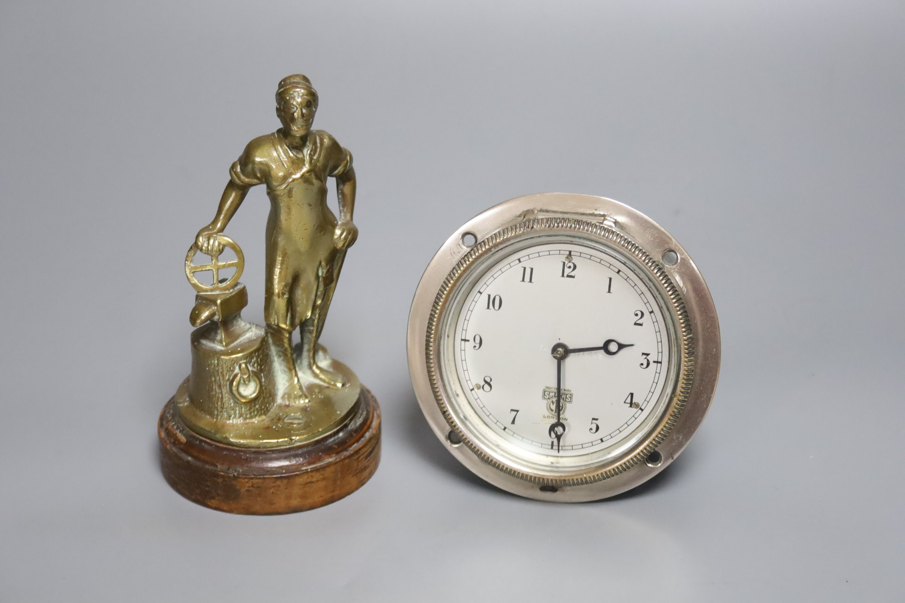 A Smiths nickel cased Alvis dashboard timepiece, serial no.177008 and a brass Foden mascot